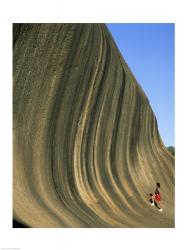 Person climbing Wave Rock, Western Australia, Australia | Obraz na stenu
