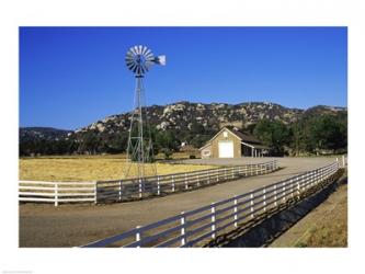Industrial windmill on a farm, California, USA | Obraz na stenu