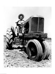 Farmer Sitting on a Tractor in a Field | Obraz na stenu