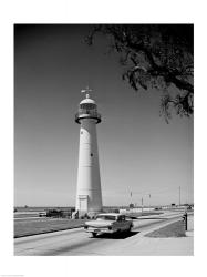 USA, Mississippi, Biloxi, Biloxi Lighthouse with street in the foreground | Obraz na stenu