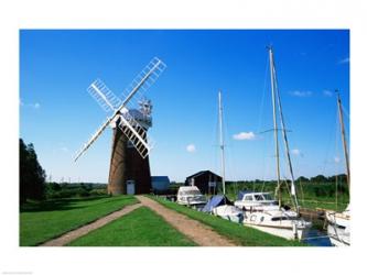 Boat moored near a traditional windmill, River Ant, Norfolk Broads, Norfolk, England | Obraz na stenu