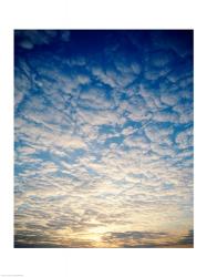 Low angle view of sunrise seen through clouds | Obraz na stenu