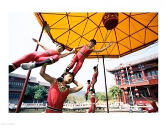 Group of children performing acrobatics, Shanghai, China | Obraz na stenu