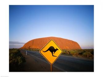 Kangaroo sign on a road with a rock formation in the background, Ayers Rock | Obraz na stenu