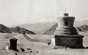 A Tibetan Mani-wall, near Leh in the Himalayas, terminated by two relic towers or chorlens. These stone structures are a compilation of intricately carved stone tablets, most with the inscription "Om Mani Padme Hum" which loosely translates to "Hail to th | Obraz na stenu