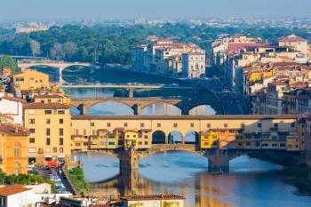Florence, Tuscany, Italy. View from Piazzale Michelangelo to bridges across Arno river. Ponte Vecchio in foreground. (photo) | Obraz na stenu