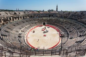Nimes, Gard Department, Languedoc-Roussillon, France. Interior of the Roman amphitheatre. The amphitheatre is used for various events. Here it is being prepared for a bullfight. | Obraz na stenu