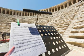 Aspendos, Antalaya Province, Turkey. The Roman theatre which is still in use. Orchestral equipment on stage in preparation for a performance. | Obraz na stenu