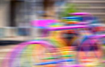 Colorful metal bike stands motion blur effect, 2016, (photograph) | Obraz na stenu