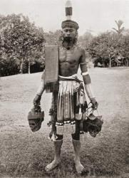A Dayak, Dyak or Dayuh man from the island of Borneo, seen here in gala costume. Every year or two the Dayaks hold a feast called Gawai Autu in honour of the departed spirits which they believe surround the heads which hang in their houses. After a 19th c | Obraz na stenu
