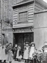 Children outside John Pounds's workshop, from which he ran the first Ragged school (b/w photo) | Obraz na stenu