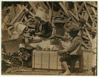 2 year old Cyral hulling strawberries from his cart at Johnson's Hulling Station, Seaford, Delaware, sometimes falling asleep for a few minutes, 1910 (b/w photo) | Obraz na stenu