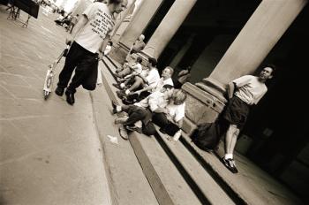 Man wearing a 'Jesus' T-shirt staring at lovers, 2004 (b/w photo) | Obraz na stenu