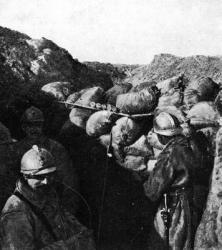 Enemies in the same trench during WWI, French and German soldiers seperated only by a wall of sandbags (b/w photo) | Obraz na stenu