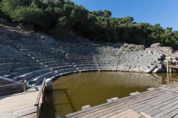 Albania. Butrint or Buthrotum archeological site; a UNESCO World Heritage Site. The theatre. A rising water table has flooded the orchestra. (photo) | Obraz na stenu