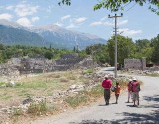 Tlos, Antalya Province, Turkey. Ruins of the ancient city. Children on road in front of theatre dating from Roman era. | Obraz na stenu