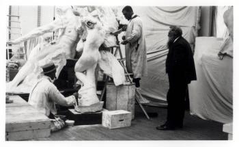 Auguste Rodin (1840-1917) in his Paris studio watching the construction of a sculpture, 1905 (b/w photo) | Obraz na stenu