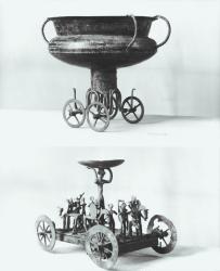 Two votive chariots for collecting rainwater: Top - cup supported on four wheels from the Peccatel tumulus, Mecklembourg, Germany. Bottom - standing female divinity beneath a plate surrounded by warriors on horseback (bronze) | Obraz na stenu