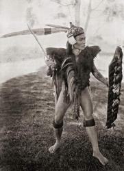 A Lirong warrior of the Baram District, Sarawak, Borneo, Malaysia. His coat was made of goat skin and his shield covered with human hair obtained from his enemies. The long feathers in his war cap were plucked from the helmeted hornbill and the rhinoceros | Obraz na stenu