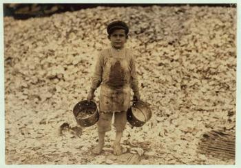 5 year old migrant shrimp-picker Manuel in front of a pile of oyster shells, working for a second year at Dunbar, Lopez, Dukate Company, Biloxi, Mississippi, 1911 (b/w photo) | Obraz na stenu