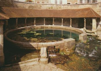 View of the wash-house constructed around the Fosse Dionne (photo) | Obraz na stenu