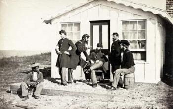 Five Civil War soldiers gathered on dirt porch outside home, African American youth seated near them, 1861-65 (b/w photo) | Obraz na stenu